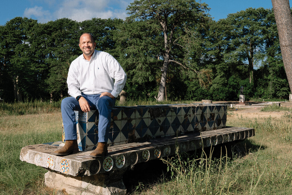 Chris Mitre sitting on concrete structure