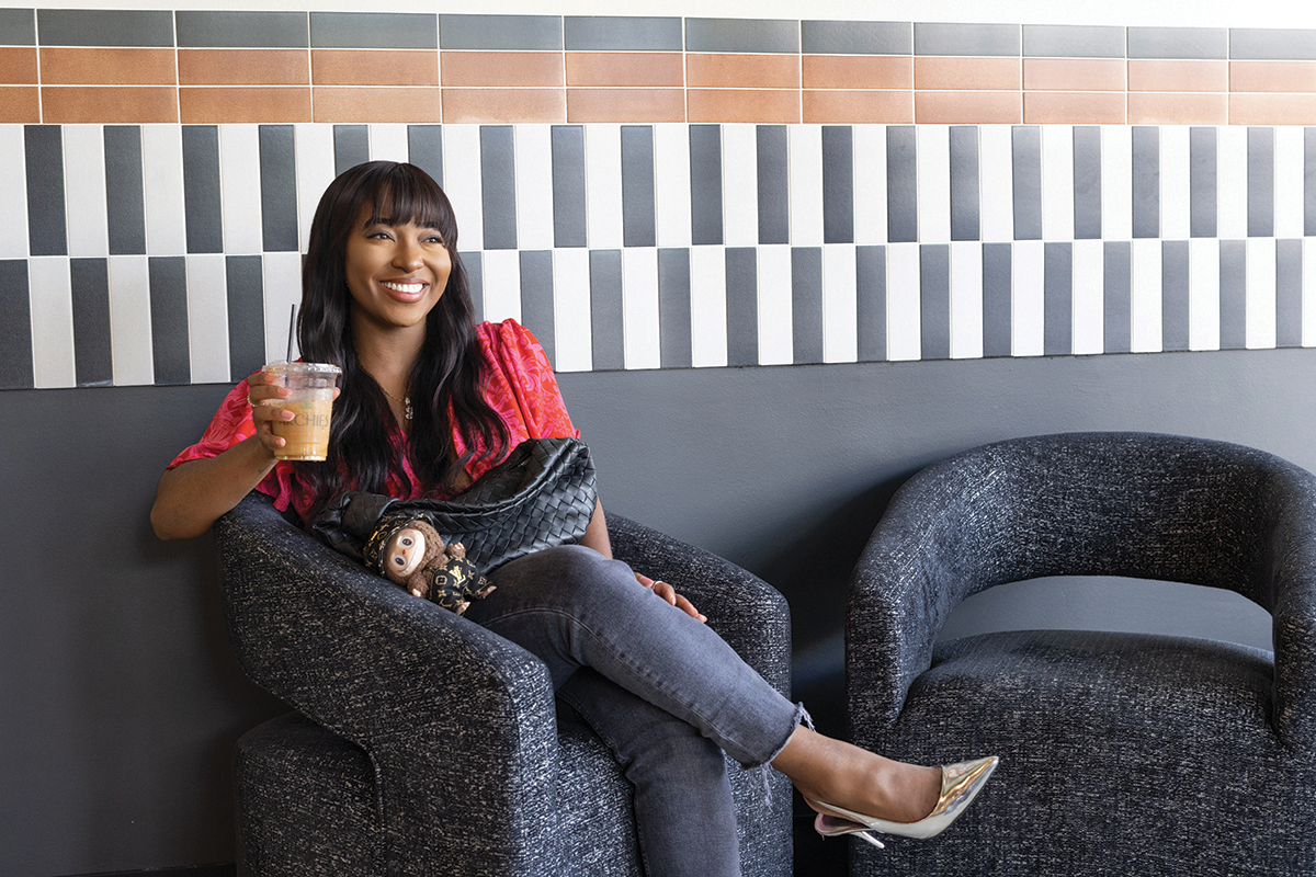 Jada Picket sitting on sofa