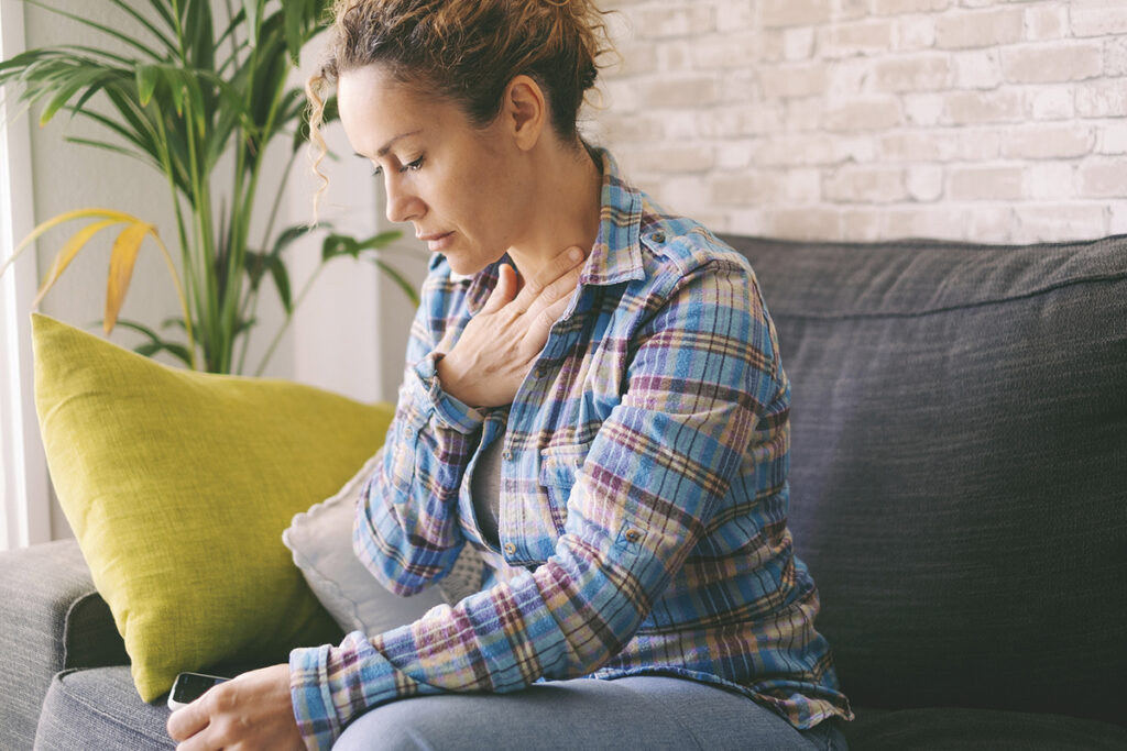 Pressure In The Chest. Close up Photo Of A Stressed Woman Who Is